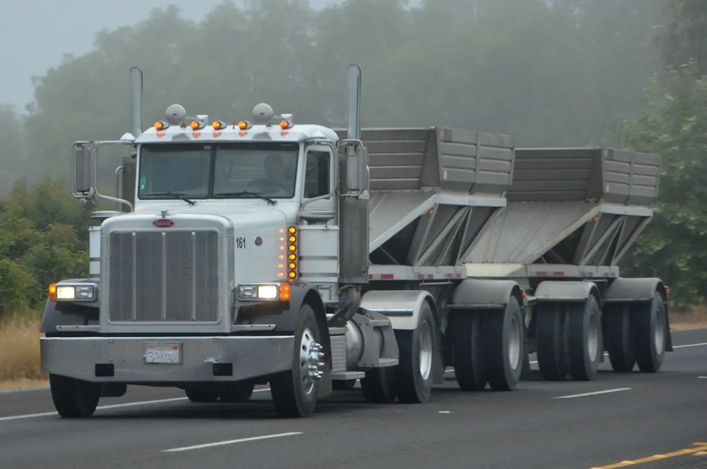 Bottom dump truck and trailer